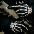 Reaper Tactical Skeleton Gloves showcase holding a rifle